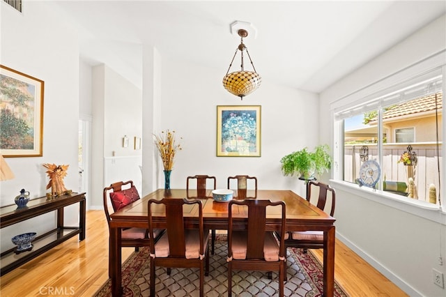 23974 Via Astuto, Murrieta, CA 92562 - dining area with lofted ceiling and light wood finished floors