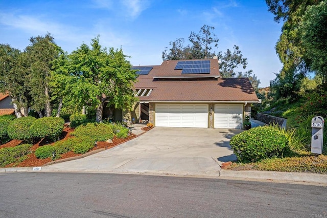 4750 Jeffer Ln, La Mesa, CA 91941 - view of front of home featuring driveway, solar panels, and roof with shingles