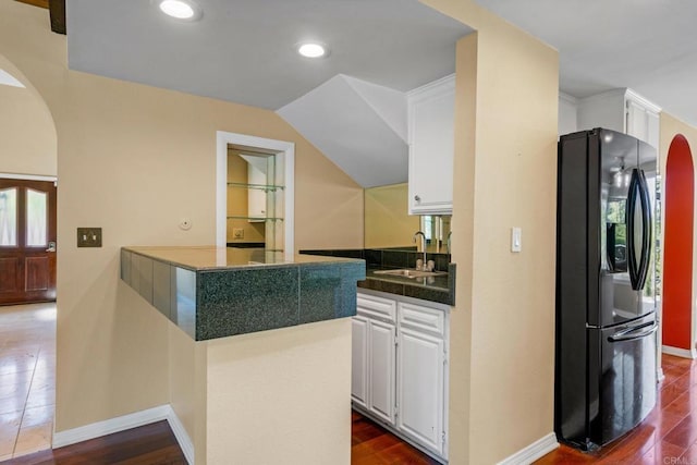 4750 Jeffer Ln, La Mesa, CA 91941 - kitchen featuring black fridge with ice dispenser, arched walkways, white cabinetry, a peninsula, and recessed lighting
