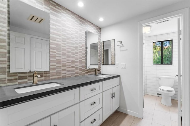 4750 Jeffer Ln, La Mesa, CA 91941 - full bathroom featuring tile walls, double vanity, tile patterned flooring, recessed lighting, and decorative backsplash