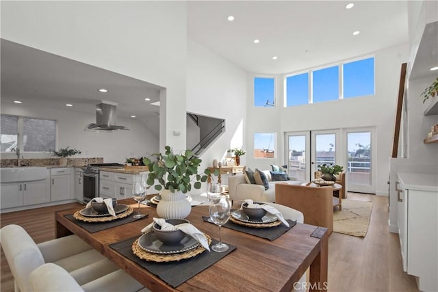 16743 Bayview Dr Unit A, Sunset Beach, CA 90742 - dining room with a high ceiling, light wood finished floors, and recessed lighting