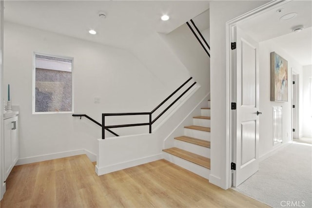 16743 Bayview Dr Unit A, Sunset Beach, CA 90742 - stairway featuring wood finished floors and recessed lighting