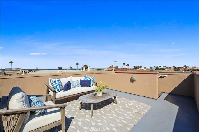 16743 Bayview Dr Unit A, Sunset Beach, CA 90742 - view of patio / terrace with an outdoor hangout area and a water view