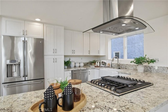 16743 Bayview Dr Unit A, Sunset Beach, CA 90742 - kitchen featuring stainless steel appliances, island range hood, light stone counters, white cabinetry, and recessed lighting