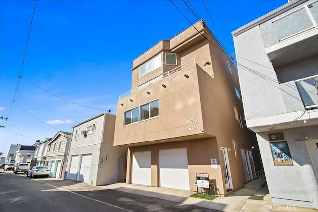 16743 Bayview Dr Unit A, Sunset Beach, CA 90742 - view of building exterior featuring a garage
