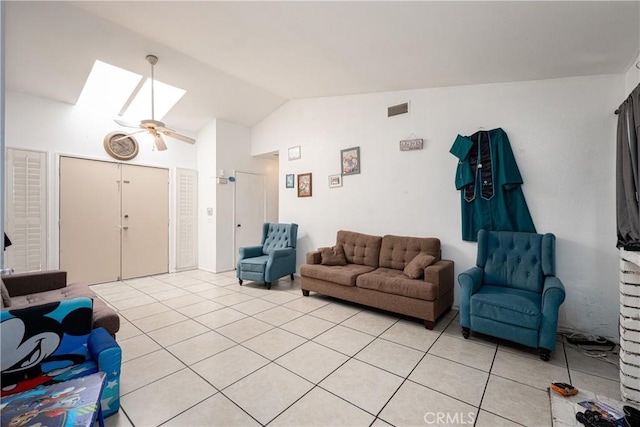 13848 Golden Eagle Ct, Moreno Valley, CA 92553 - living room with a skylight, vaulted ceiling, light tile patterned flooring, and ceiling fan