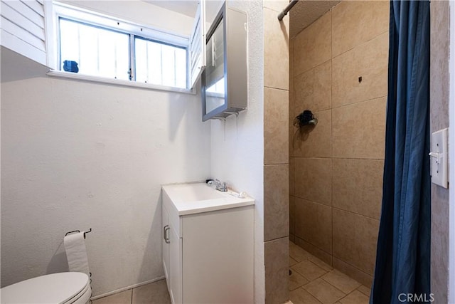 13848 Golden Eagle Ct, Moreno Valley, CA 92553 - bathroom featuring a tile shower, vanity, plenty of natural light, and tile patterned floors