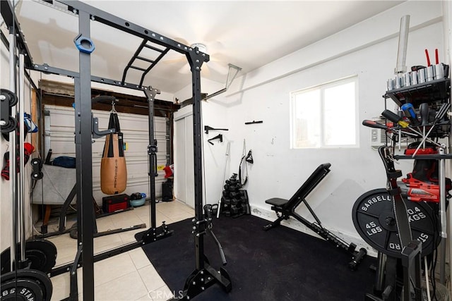 13848 Golden Eagle Ct, Moreno Valley, CA 92553 - workout area with a garage and tile patterned floors