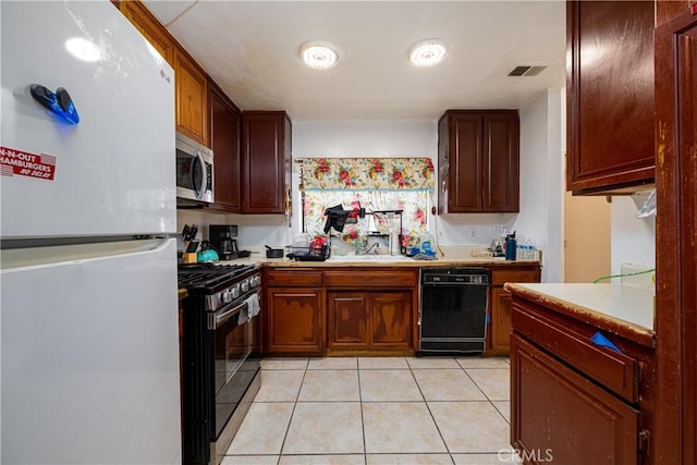 13848 Golden Eagle Ct, Moreno Valley, CA 92553 - kitchen with stainless steel appliances, light countertops, and light tile patterned floors