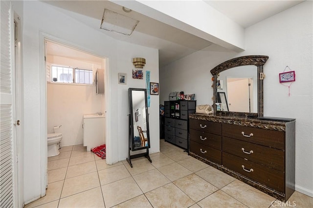 13848 Golden Eagle Ct, Moreno Valley, CA 92553 - bedroom featuring light tile patterned floors and ensuite bath
