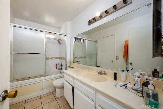 13848 Golden Eagle Ct, Moreno Valley, CA 92553 - bathroom with vanity, tile patterned flooring, and enclosed tub / shower combo