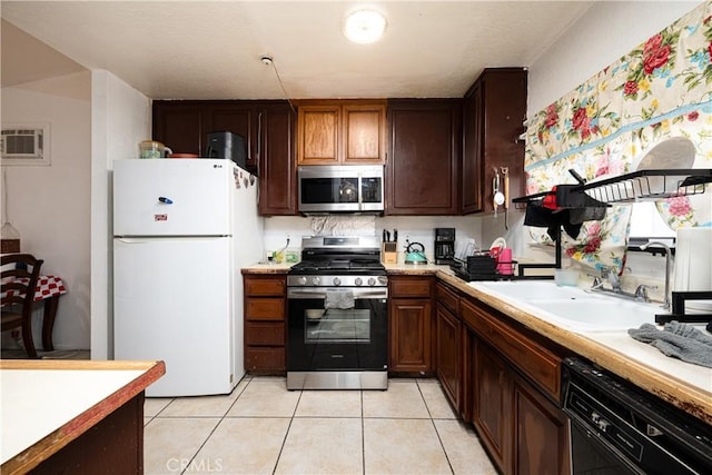 13848 Golden Eagle Ct, Moreno Valley, CA 92553 - kitchen featuring appliances with stainless steel finishes, light countertops, light tile patterned floors, and an AC wall unit