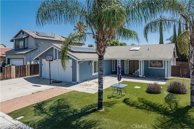 13848 Golden Eagle Ct, Moreno Valley, CA 92553 - view of front of property with driveway, solar panels, a garage, and a tile roof