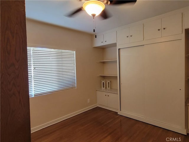 10563 Las Lunitas Ave, Tujunga, CA 91042 - unfurnished bedroom featuring dark wood finished floors, ceiling fan, and a closet