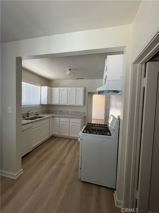 10563 Las Lunitas Ave, Tujunga, CA 91042 - kitchen with white appliances, under cabinet range hood, wood finished floors, white cabinetry, and light countertops