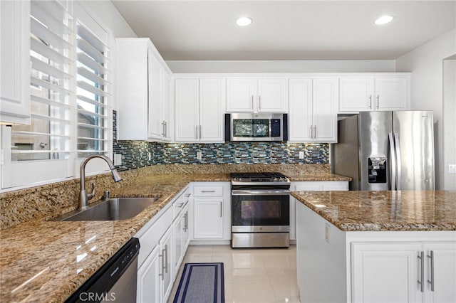 23825 Lancer Ct, Wildomar, CA 92595 - kitchen featuring stainless steel appliances, white cabinets, stone counters, tasteful backsplash, and recessed lighting