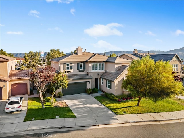 23825 Lancer Ct, Wildomar, CA 92595 - traditional home with stucco siding, concrete driveway, a tile roof, and a mountain view