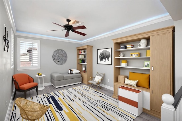 23825 Lancer Ct, Wildomar, CA 92595 - living room featuring a ceiling fan, wood finished floors, and crown molding