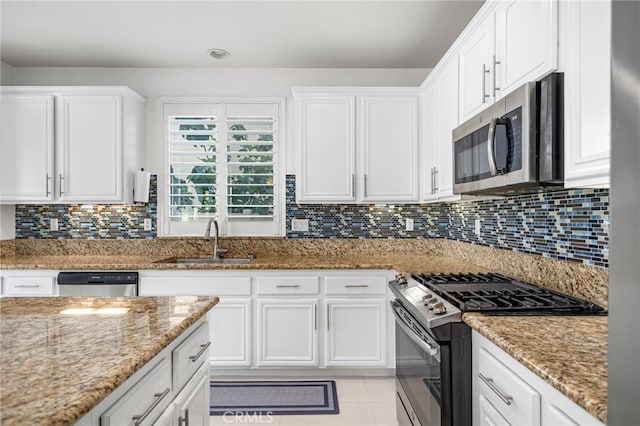 23825 Lancer Ct, Wildomar, CA 92595 - kitchen featuring appliances with stainless steel finishes, white cabinets, and light stone countertops
