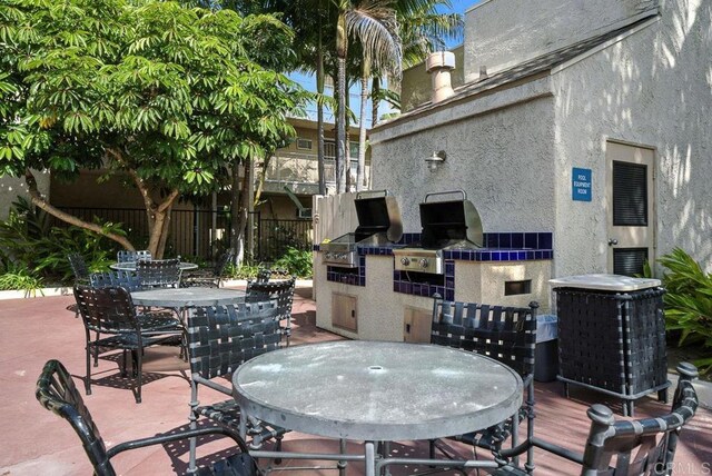 5252 Orange Ave Unit 326, San Diego, CA 92115 - view of patio / terrace featuring outdoor dining space and area for grilling