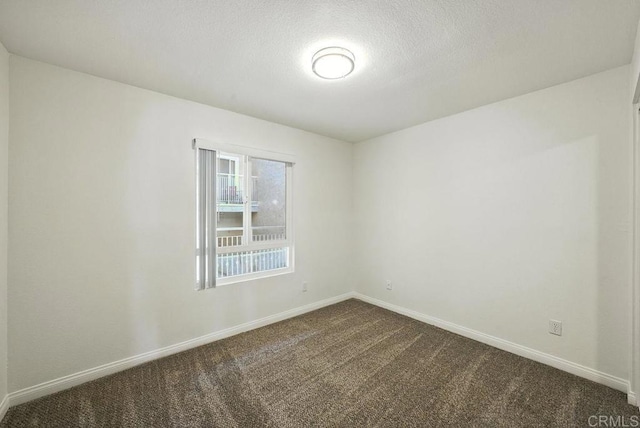 5252 Orange Ave Unit 326, San Diego, CA 92115 - spare room featuring dark colored carpet and a textured ceiling