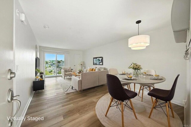 5252 Orange Ave Unit 326, San Diego, CA 92115 - dining room with light wood-style floors and baseboards