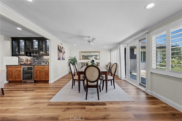 2777 Shadow Canyon Cir, Norco, CA 92860 - dining space with wine cooler, bar area, a ceiling fan, recessed lighting, and light wood finished floors