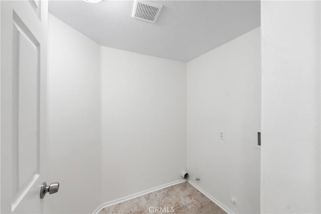 39524 Hawthorne St, Palmdale, CA 93551 - laundry room featuring a textured ceiling and baseboards