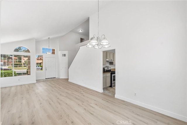 39524 Hawthorne St, Palmdale, CA 93551 - unfurnished living room with a chandelier, high vaulted ceiling, and light wood-type flooring