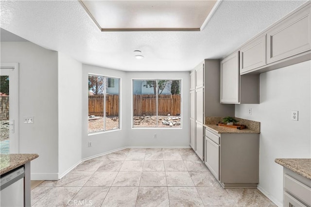 39524 Hawthorne St, Palmdale, CA 93551 - unfurnished dining area with a textured ceiling