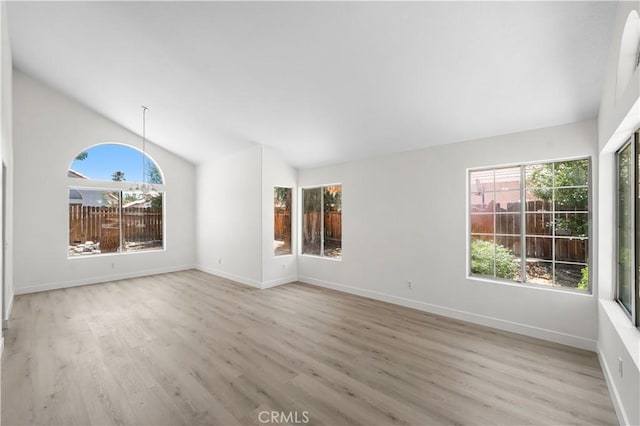 39524 Hawthorne St, Palmdale, CA 93551 - unfurnished living room featuring lofted ceiling and wood finished floors