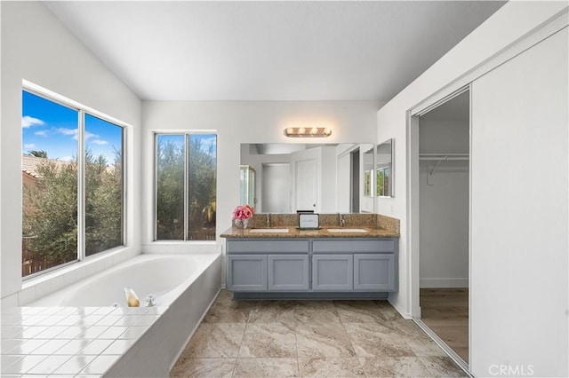39524 Hawthorne St, Palmdale, CA 93551 - full bath with double vanity, a bath, and a walk in closet