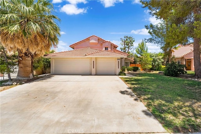 39524 Hawthorne St, Palmdale, CA 93551 - mediterranean / spanish-style house featuring a tile roof, a garage, concrete driveway, and stucco siding
