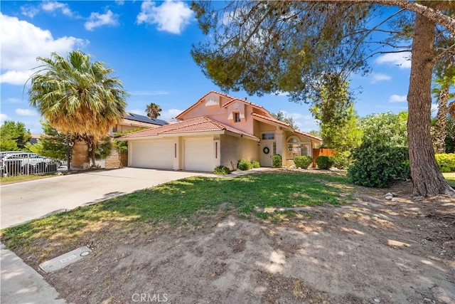 39524 Hawthorne St, Palmdale, CA 93551 - mediterranean / spanish home featuring stucco siding, a garage, driveway, a tiled roof, and solar panels