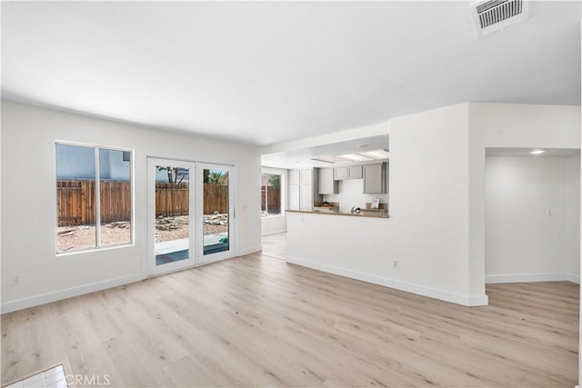 39524 Hawthorne St, Palmdale, CA 93551 - unfurnished living room featuring light wood finished floors and french doors