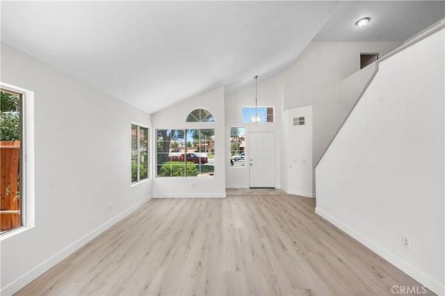 39524 Hawthorne St, Palmdale, CA 93551 - foyer featuring healthy amount of natural light, wood finished floors, lofted ceiling, and a chandelier