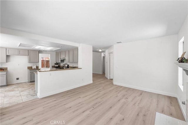 39524 Hawthorne St, Palmdale, CA 93551 - unfurnished living room with light wood-style floors