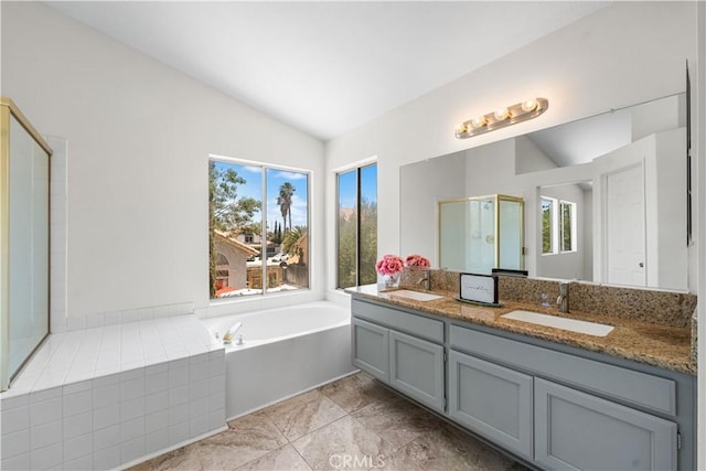 39524 Hawthorne St, Palmdale, CA 93551 - bathroom featuring lofted ceiling, double vanity, a garden tub, a stall shower, and tile patterned floors