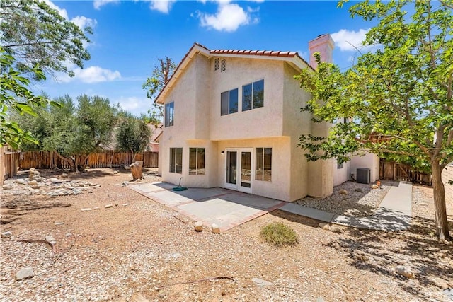39524 Hawthorne St, Palmdale, CA 93551 - back of property featuring stucco siding, a chimney, a fenced backyard, and a patio area