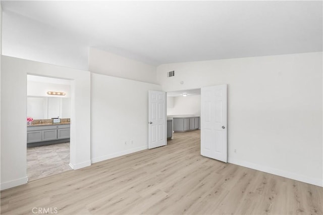 39524 Hawthorne St, Palmdale, CA 93551 - empty room with vaulted ceiling and light wood finished floors