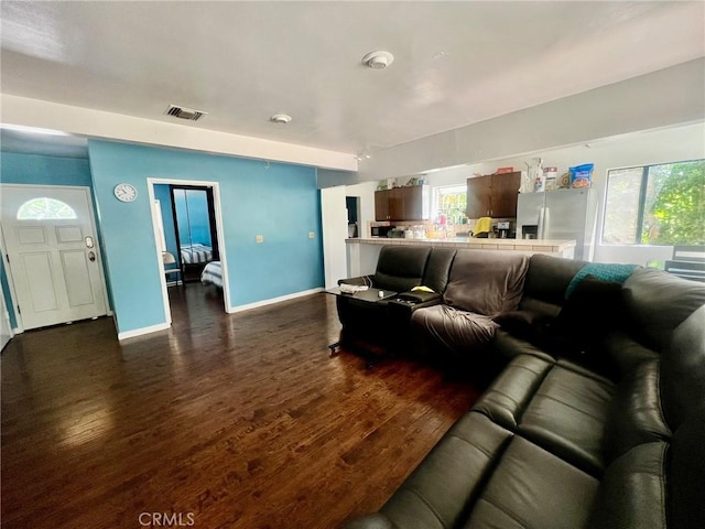 14712 Hiawatha St, San Fernando, CA 91345 - living area featuring dark wood-type flooring and baseboards