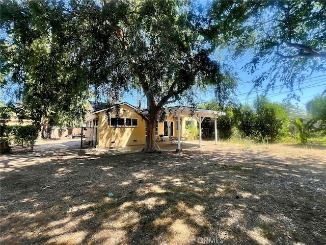 14712 Hiawatha St, San Fernando, CA 91345 - rear view of house with a patio area and crawl space