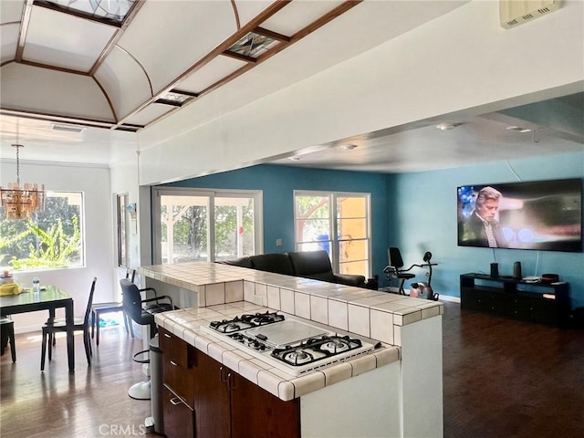 14712 Hiawatha St, San Fernando, CA 91345 - kitchen with tile counters, white gas cooktop, open floor plan, and vaulted ceiling