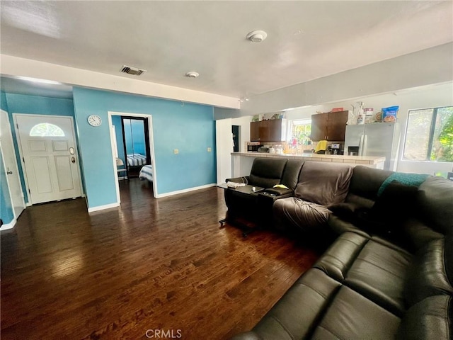 14712 Hiawatha St, San Fernando, CA 91345 - living room featuring dark wood-style flooring and baseboards