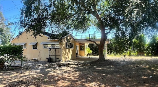 14712 Hiawatha St, San Fernando, CA 91345 - view of home's exterior with stucco siding and crawl space