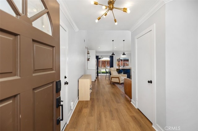 7 Via Olorosa, Rancho Santa Margarita, CA 92688 - foyer entrance featuring light wood-style floors, a chandelier, and crown molding