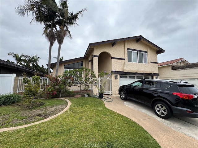 14212 Enfield Cir, Westminster, CA 92683 - view of front of home featuring stucco siding, concrete driveway, a gate, and an attached garage
