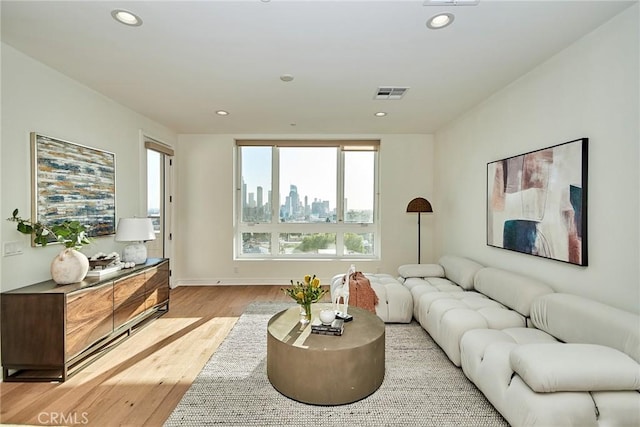1050 N Joels Pl, Los Angeles, CA 90012 - living room with light wood-type flooring and recessed lighting