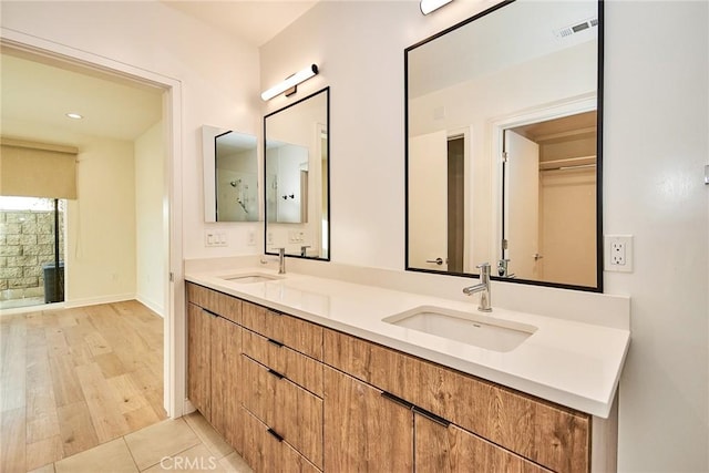 1050 N Joels Pl, Los Angeles, CA 90012 - full bathroom featuring double vanity and baseboards