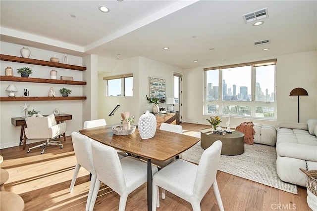 1050 N Joels Pl, Los Angeles, CA 90012 - dining room with light wood-type flooring, a view of skyline, and recessed lighting